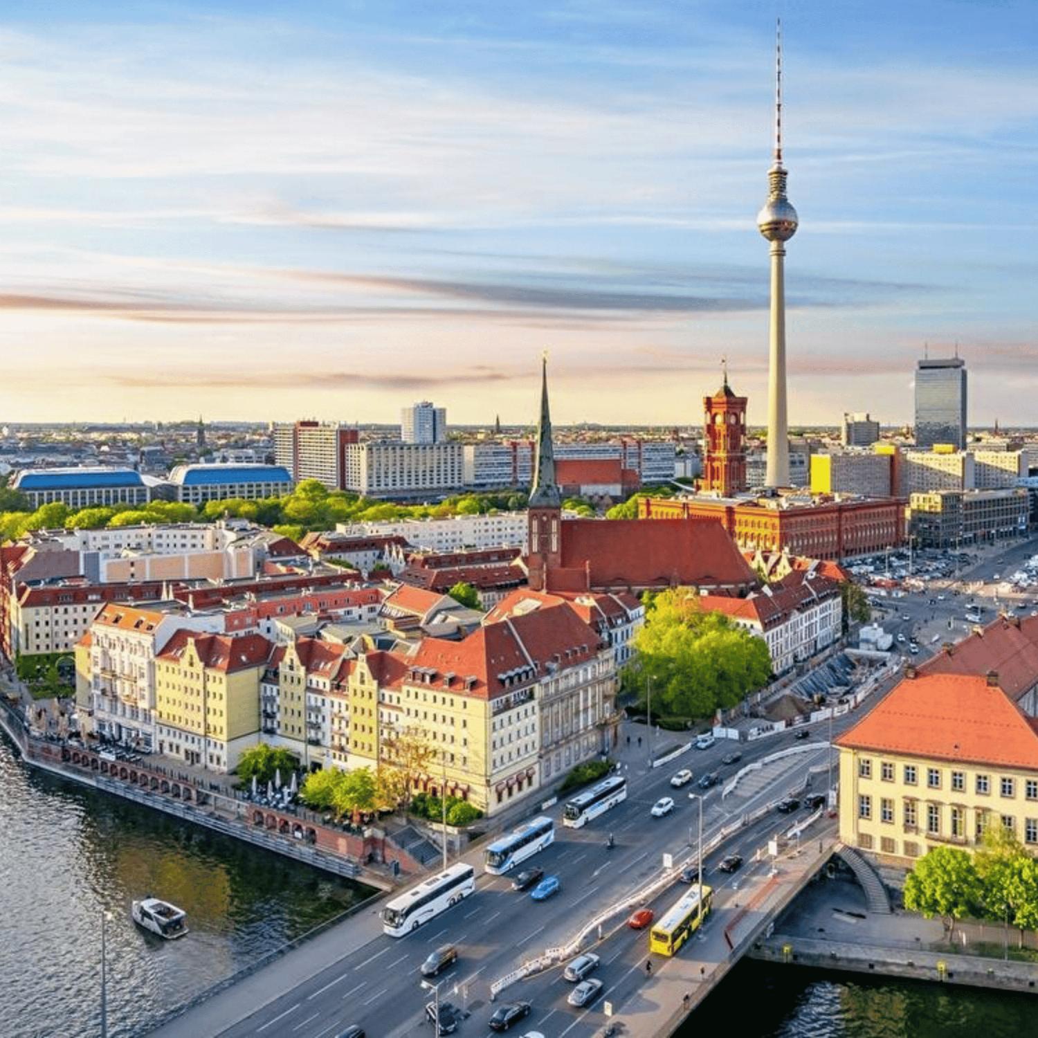 Berlin cityscape with Fernsehturm TV Tower, Red Town Hall, and Spree River at sunset