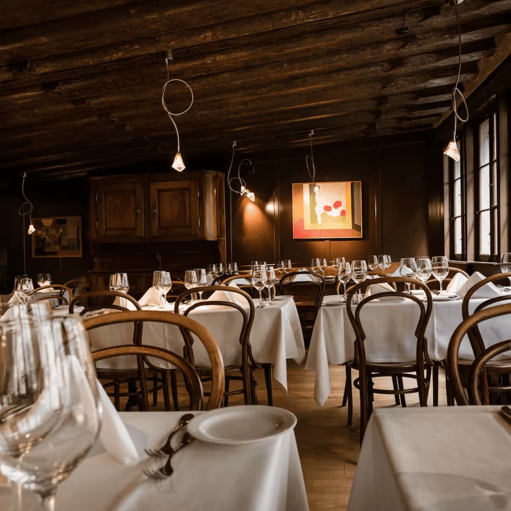Zum goldenen Schäfli, a traditional, wood-paneled restaurant with a sophisticated atmosphere.